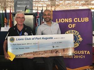 Accepting a cheque from Port Augusta Lions