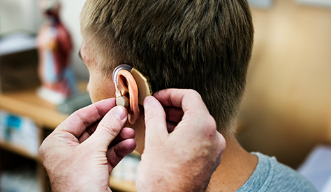 hearing aid being fitted