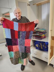 Dennis with his handmade blankets